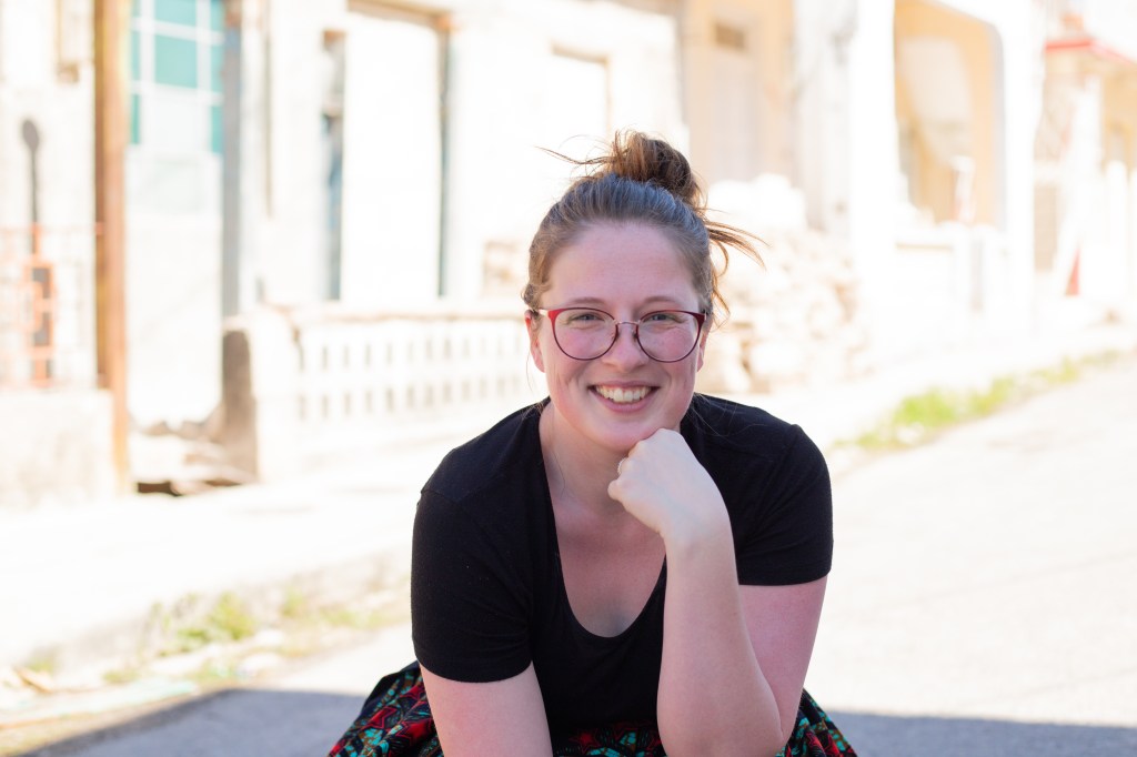 Photographer poses for photo taken by child during shoot